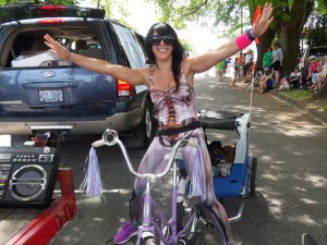 Teacher and trainer Jocelyn wore a special anatomy-themed bodysuit. She accomplished the great strength feat of towing two dogs in a bike trailer with her diminutive Schwinn.