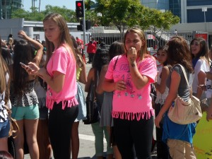 Tweens hope to glimpse One Direction's tour bus.