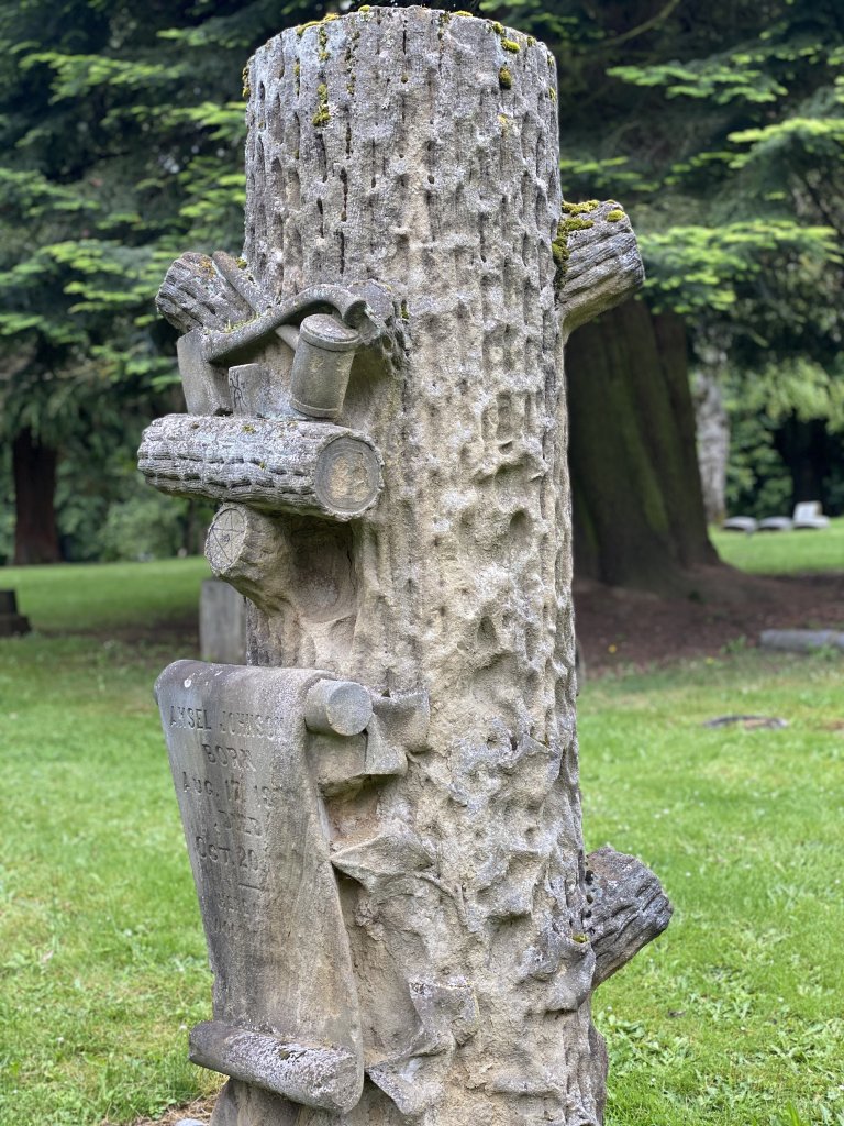 Woodmen of the World tree stump headstone