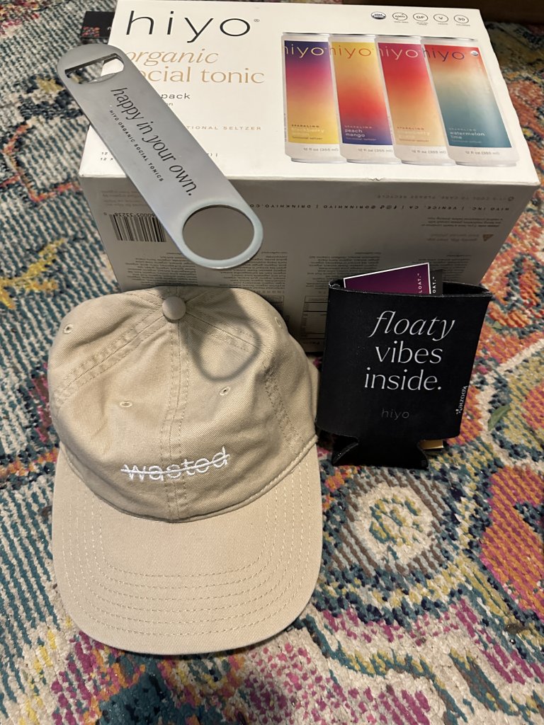 A hat, bottle opener, and a 12-pack of hiyo